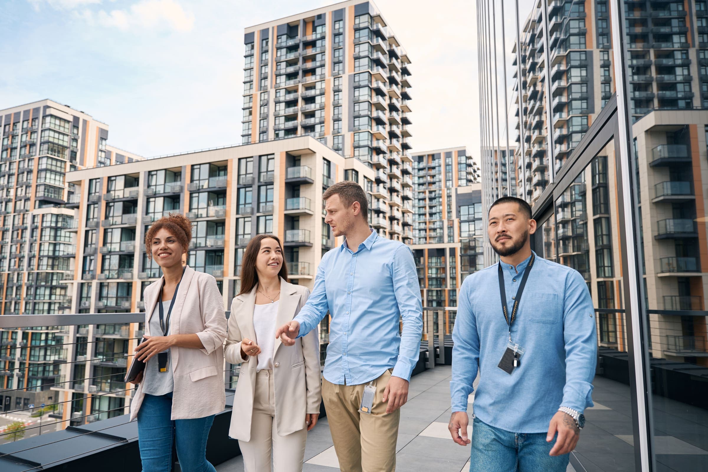 Real estate team touring a residential apartment development