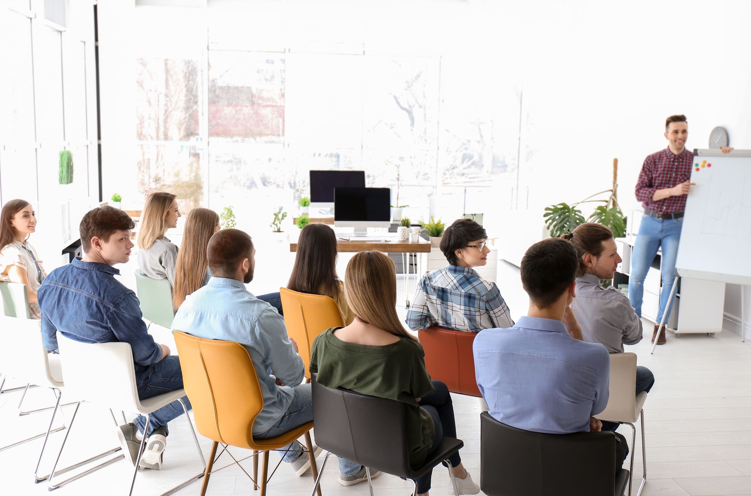 Trainer presenting to a group during a training session