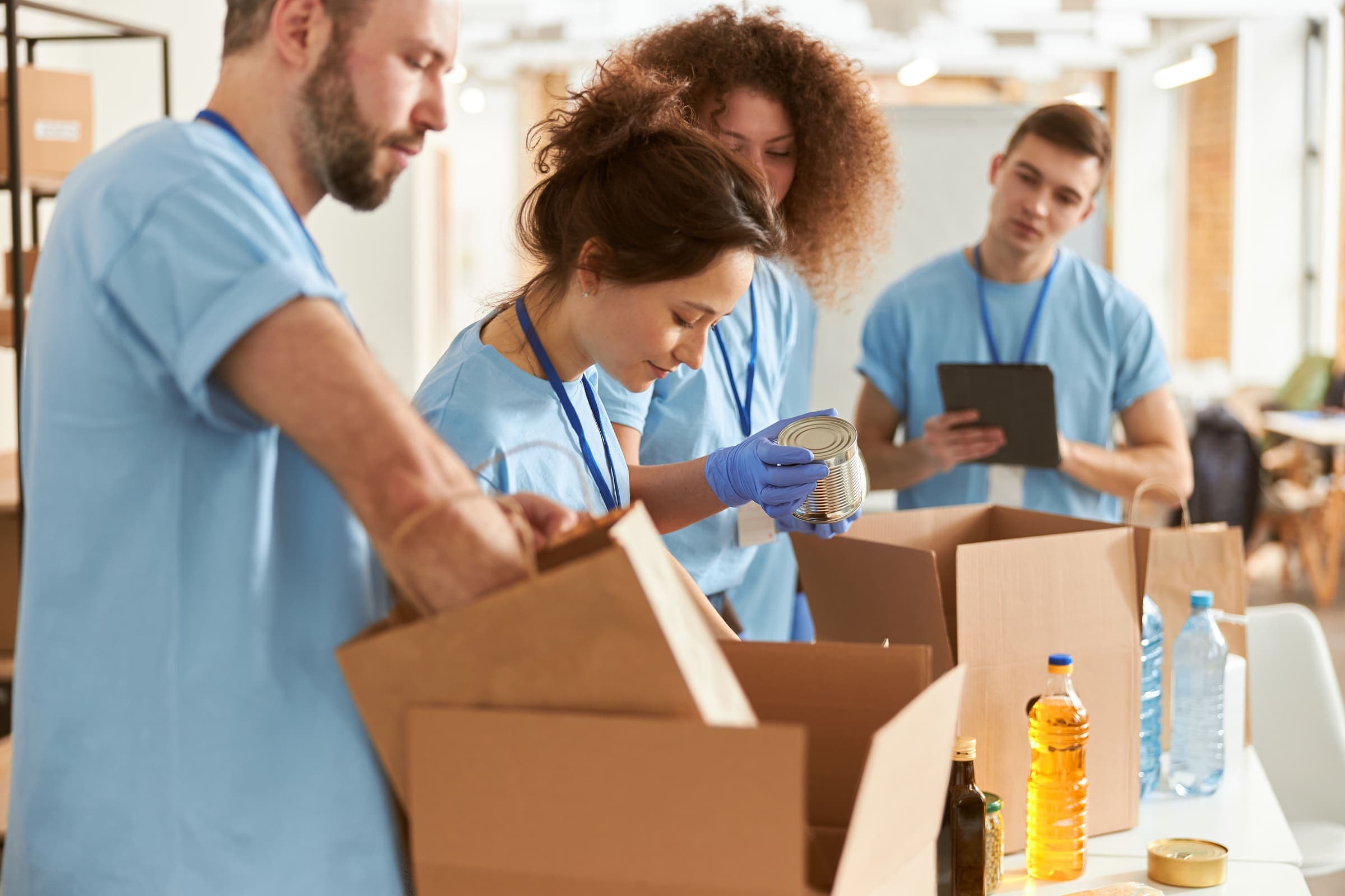 Volunteers packing boxes for a community services and charity program